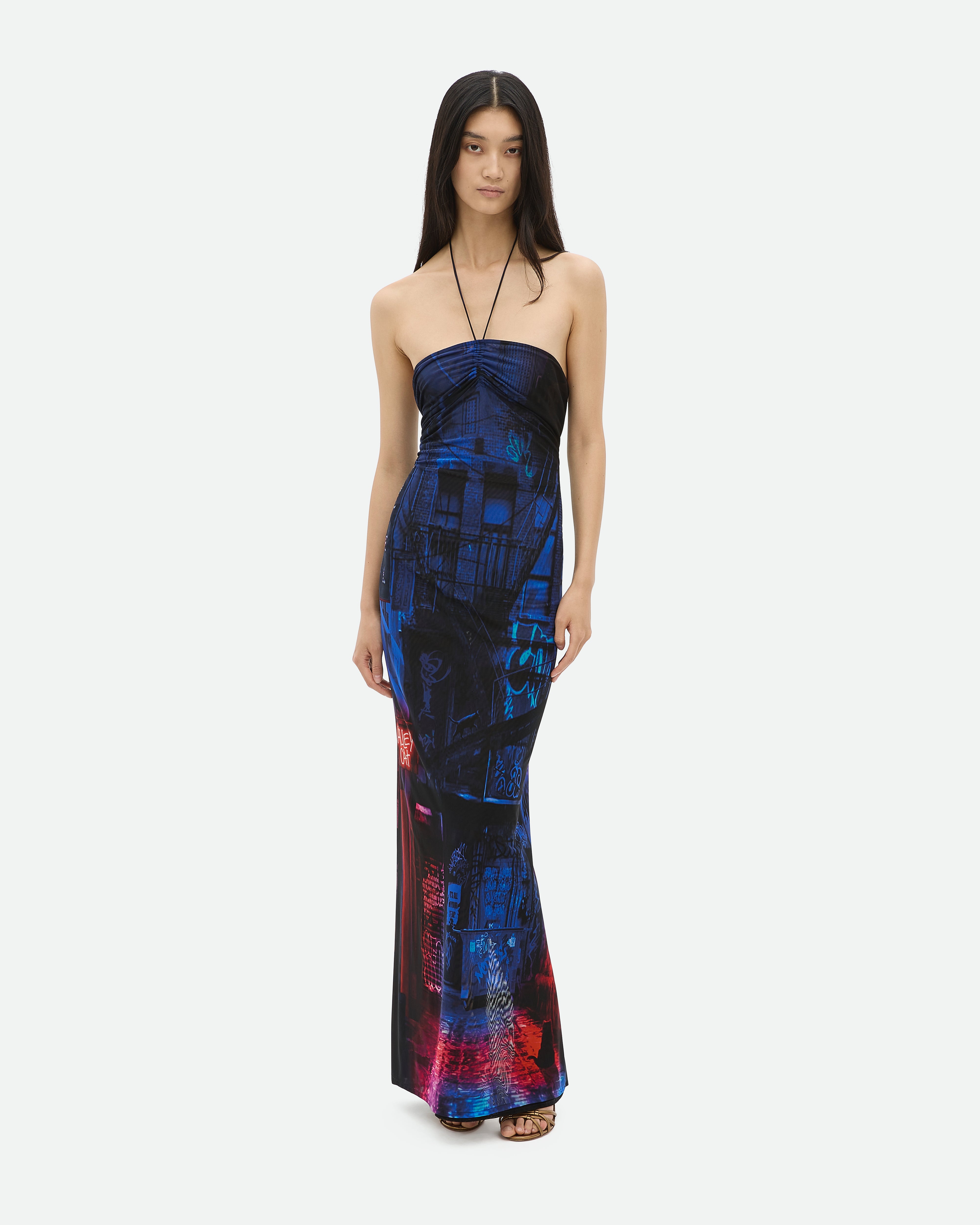 Sleeveless, floor-length, printed mesh dress with a rouched front with blue and red city print Just Us Common Hours.