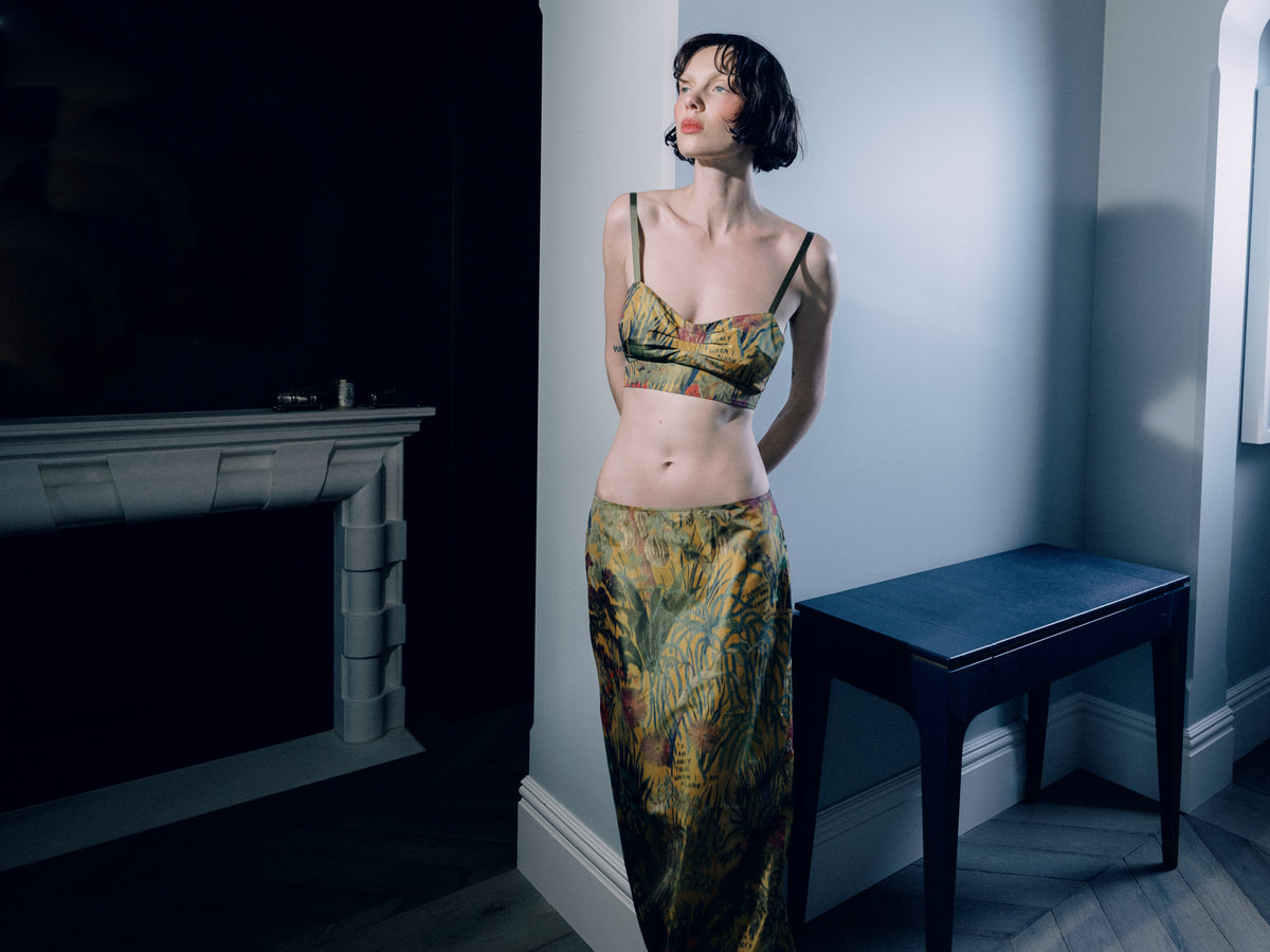 Common Hours and Abbey Lee Euphoria crop bustier top in Yellow Wallpaper Floral, inspired by the 90s