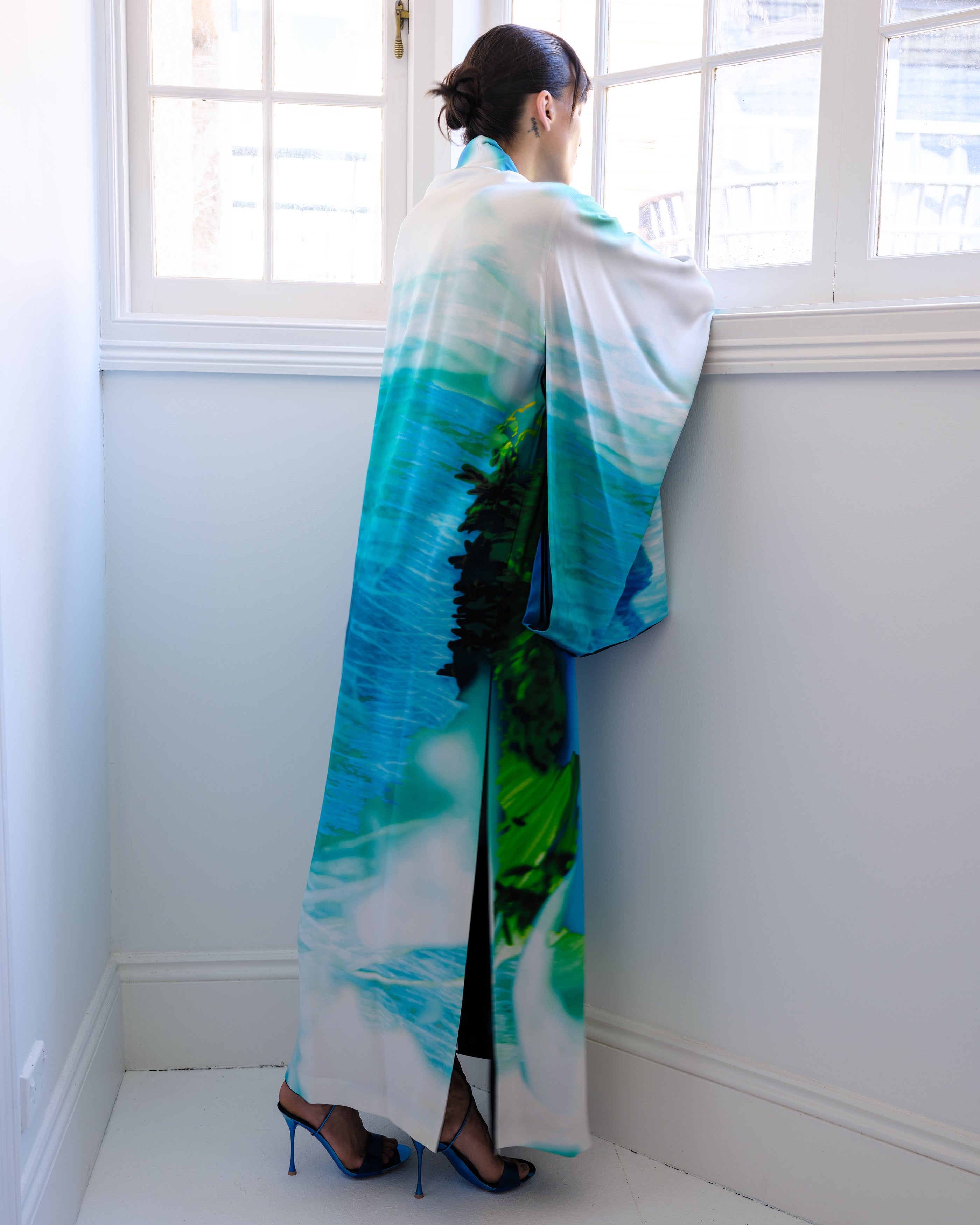 Woman wearing a Common Hours Iceberg Reversible Silk Dress