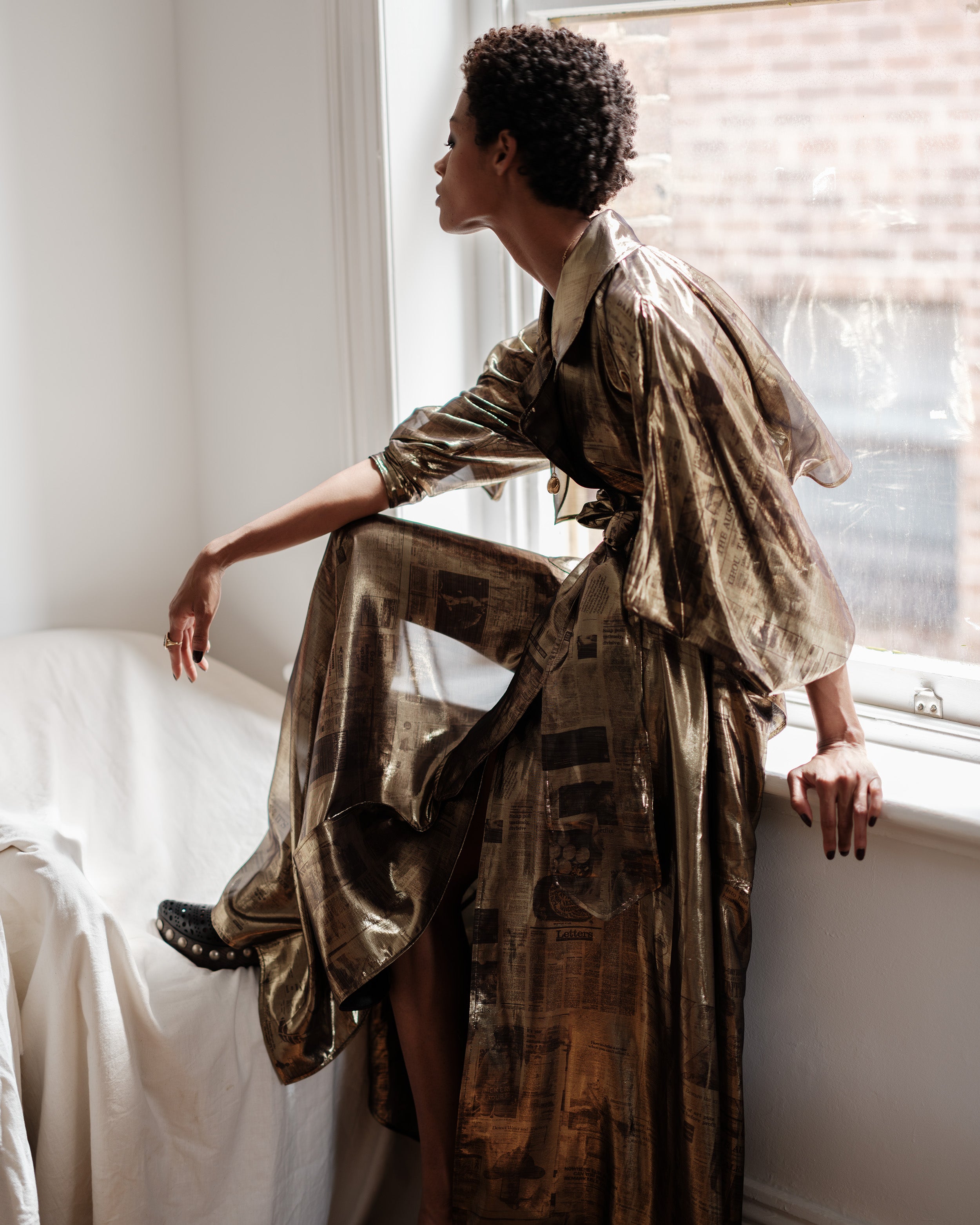 Gold newsletter print trench coat dress, Headline dress by Common Hours.