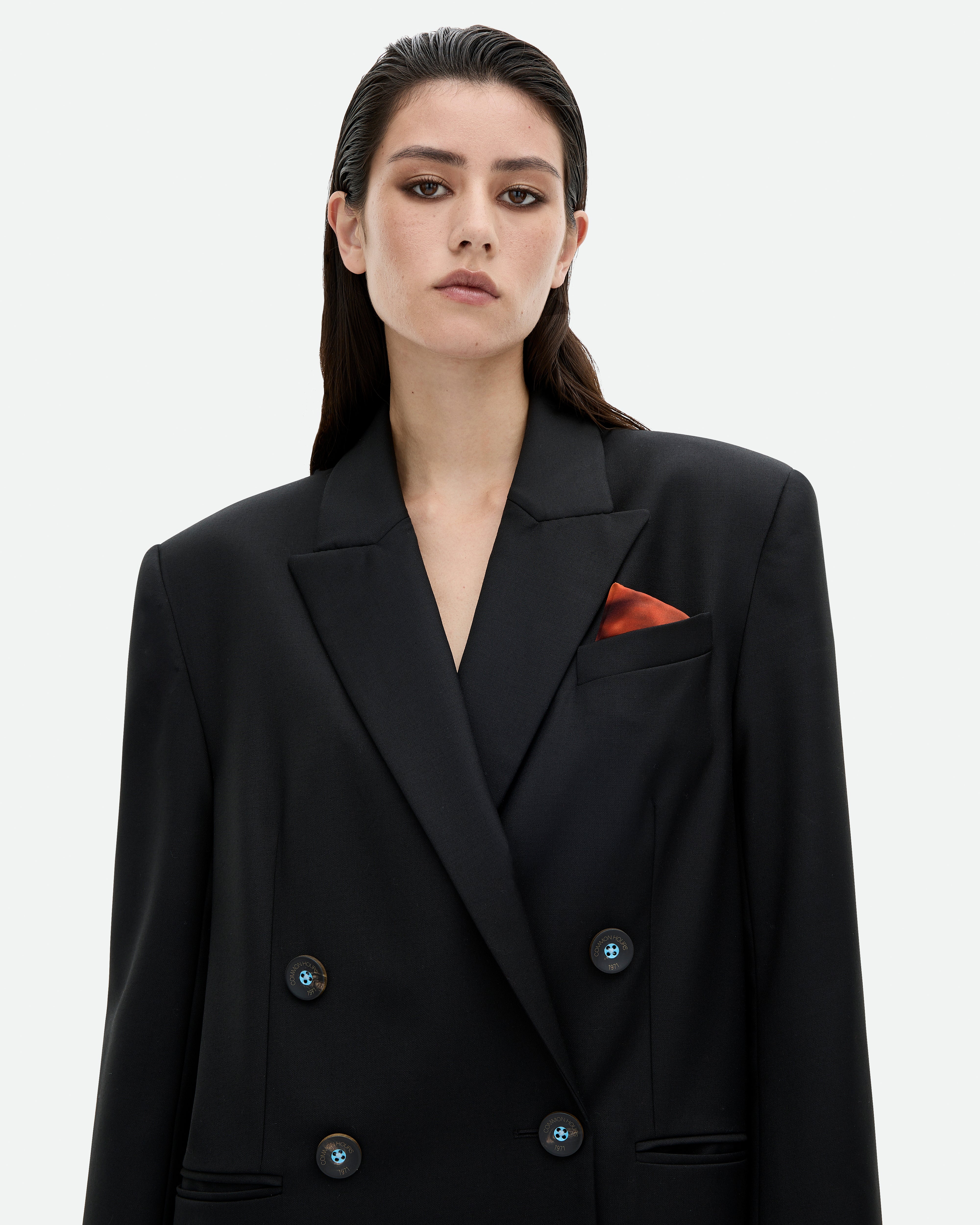 Black blazer jacket Pretender dress with a red silk pocket square from Common Hours.