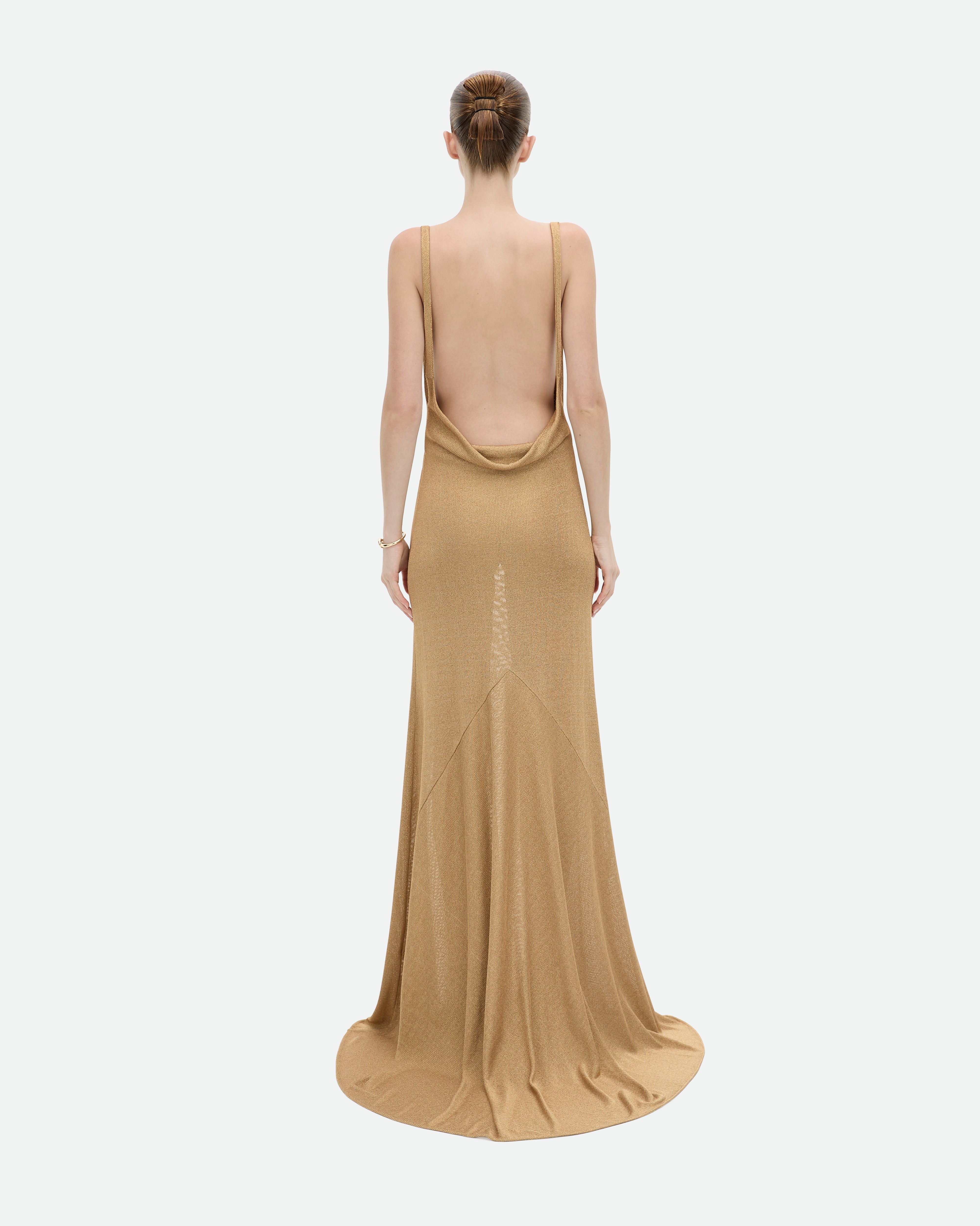 Long, flowing gold metallic dress with open back, Common Hours Prohibition dress.