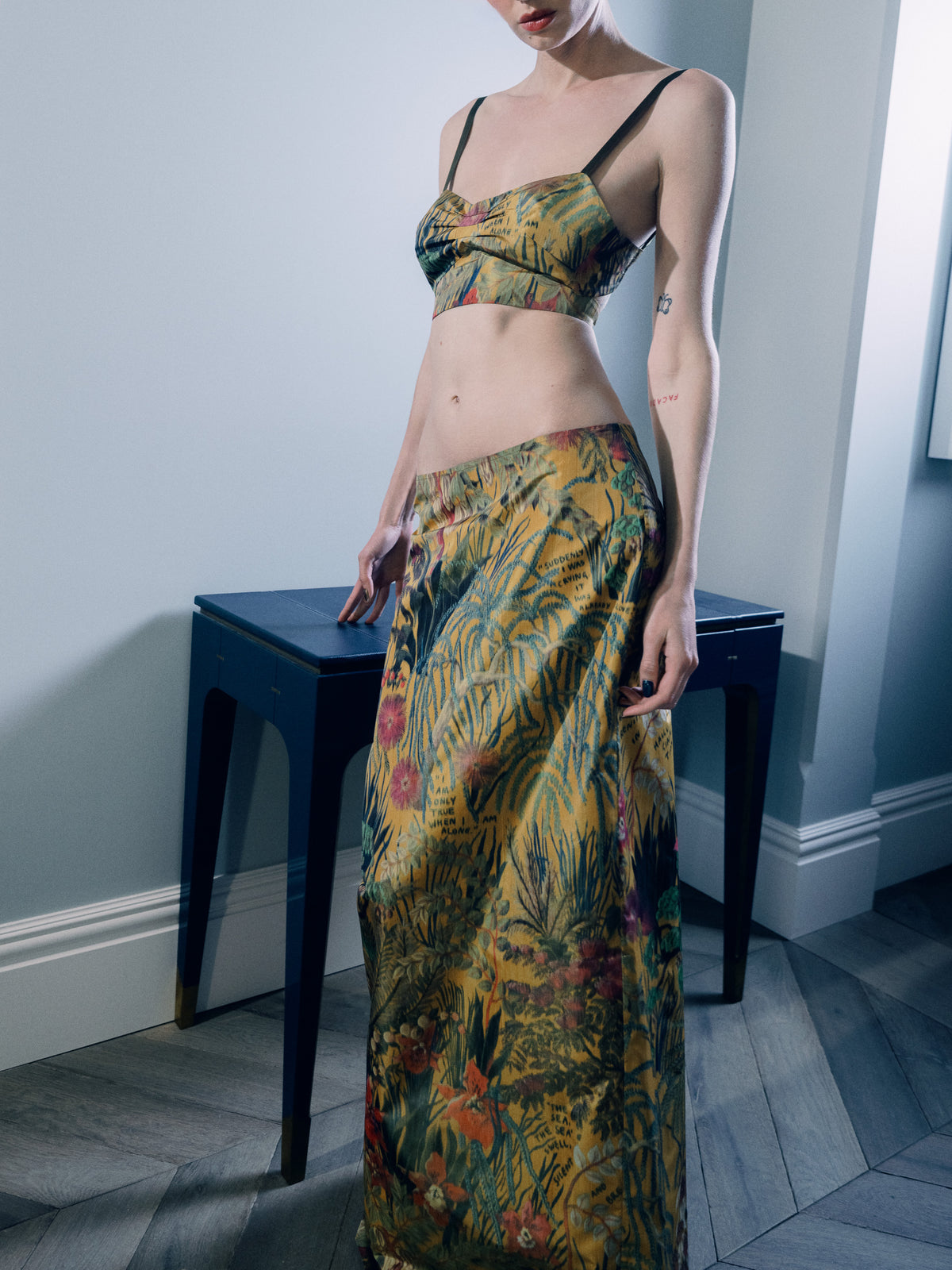  Common Hours x Abbey Lee Euphoria Skirt is a 90s-inspired, longline straight-cut skirt in Yellow Wallpaper Floral 