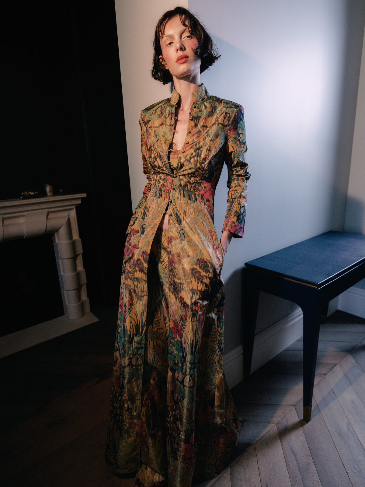 Woman wearing The Rapture Coat. Common Hours and Abbey Lee collection crafted from a bespoke floral silk-blend jacquard